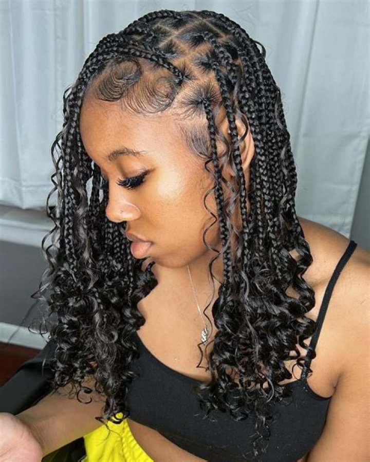 Embracing The Charm Of Curly Braids: A Style Statement